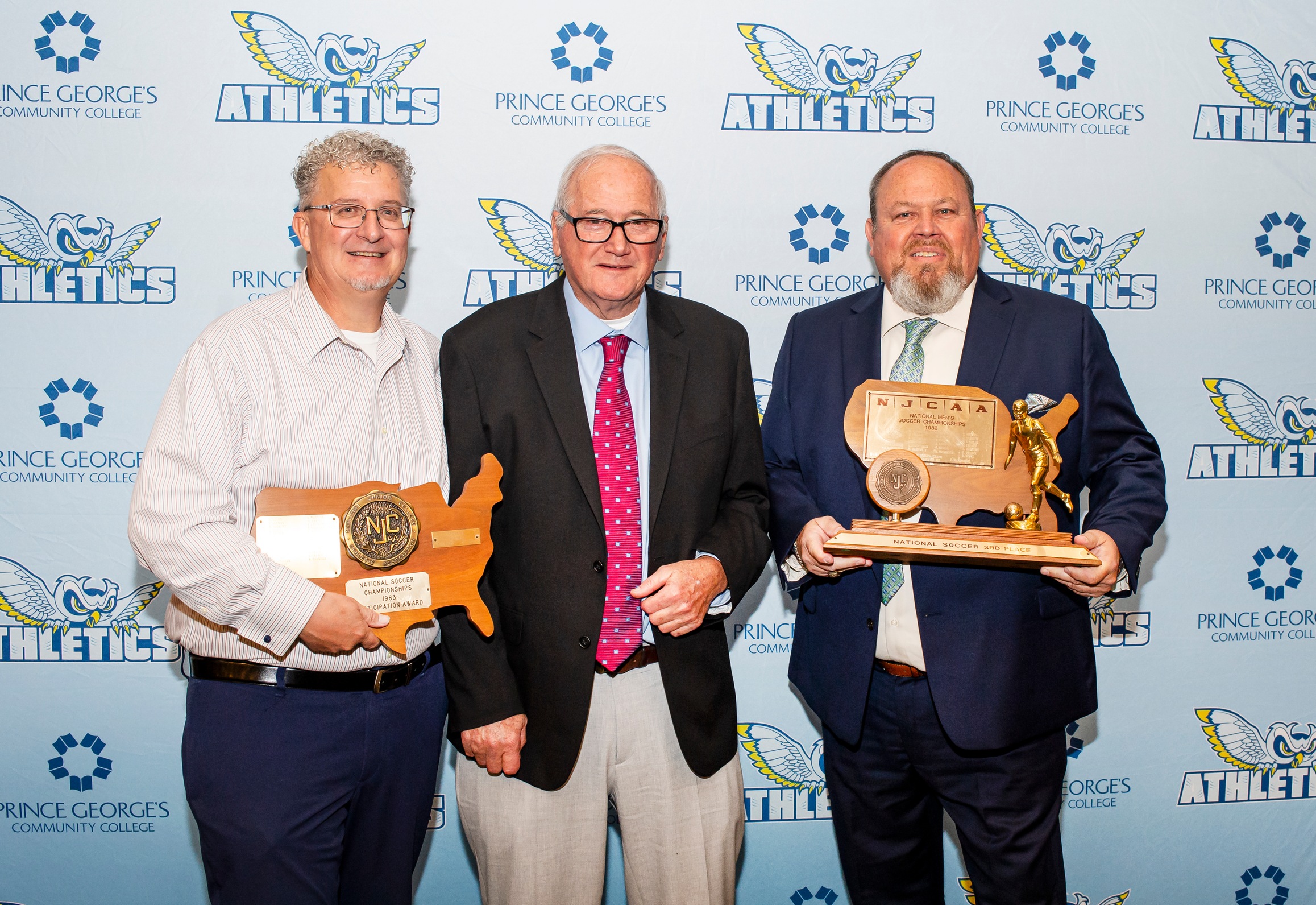 Kenneth "Kenny" Eisiminger (right) pictured with former men's soccer head coach Bernie Smolen (middle) and teammate Richard Todaro (left). Eisiminger was inducted into the PGCC Athletics Hall of Fame in Spring of 2024.